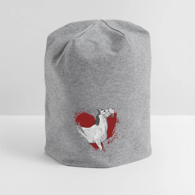 Un cheval gris et un coeur rouge